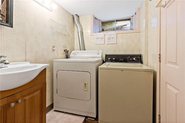 263 Prospect Rd, South Kingstown, RI 02879 - washroom with tile walls, washing machine and dryer, and light tile patterned flooring