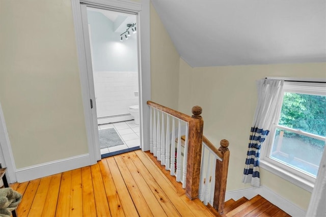 15 Boyd Ave, East Providence, RI 02914 - stairway featuring baseboard heating, wood-type flooring, and baseboards