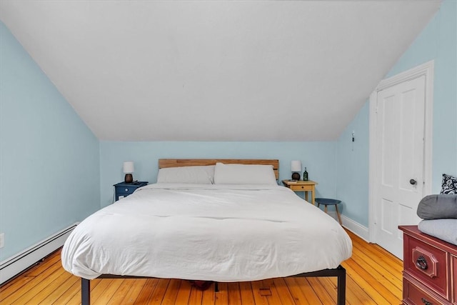 15 Boyd Ave, East Providence, RI 02914 - bedroom with a baseboard radiator, light wood-style floors, vaulted ceiling, and baseboards