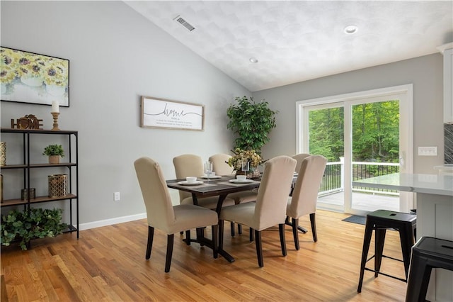 128 Old Quarry Rd, Glocester, RI 02857 - dining area featuring light wood-type flooring, lofted ceiling, and baseboards