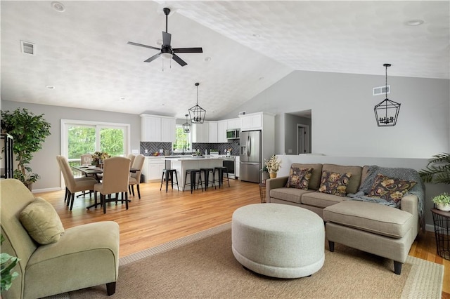 128 Old Quarry Rd, Glocester, RI 02857 - living room featuring a ceiling fan, light wood finished floors, and high vaulted ceiling