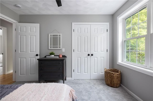 128 Old Quarry Rd, Glocester, RI 02857 - carpeted bedroom featuring a closet, multiple windows, and baseboards