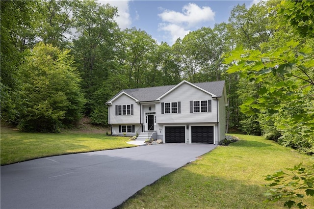 128 Old Quarry Rd, Glocester, RI 02857 - raised ranch with a garage, driveway, and a front lawn