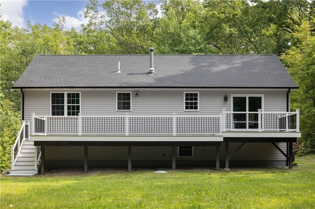 128 Old Quarry Rd, Glocester, RI 02857 - back of property featuring a shingled roof, a lawn, a deck, stairway, and view of wooded area