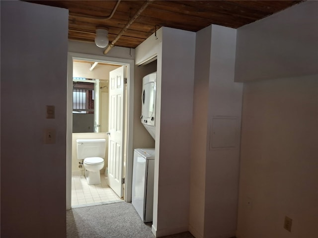 15 Higgins St Unit 106, Smithfield, RI 02917 - hall featuring stacked washing machine and dryer, carpet, and wood ceiling