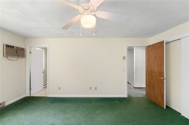 500 E Greenwich Ave Unit 108, West Warwick, RI 02893 - unfurnished bedroom with carpet, a wall mounted AC, baseboards, and ceiling fan