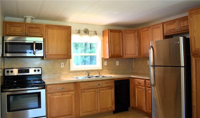19 Jacob Perry Dr, Charlestown, RI 02831 - kitchen with stainless steel appliances, light countertops, decorative backsplash, a sink, and brown cabinetry