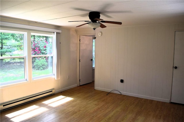 19 Jacob Perry Dr, Charlestown, RI 02831 - spare room with light wood-style floors, a ceiling fan, baseboards, and a baseboard radiator