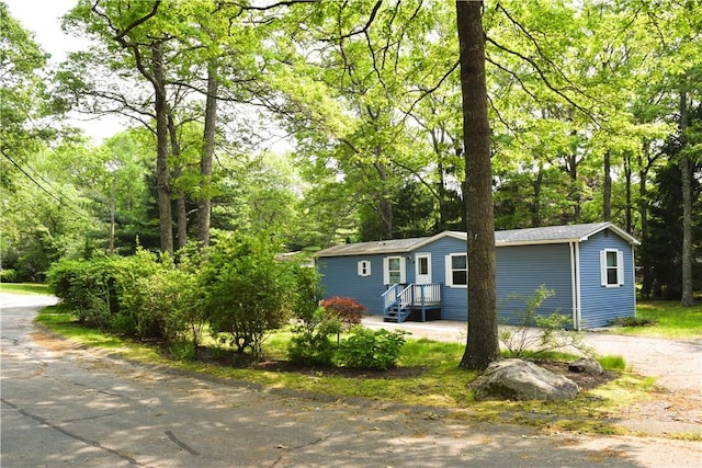 19 Jacob Perry Dr, Charlestown, RI 02831 - view of front of property featuring view of wooded area and driveway