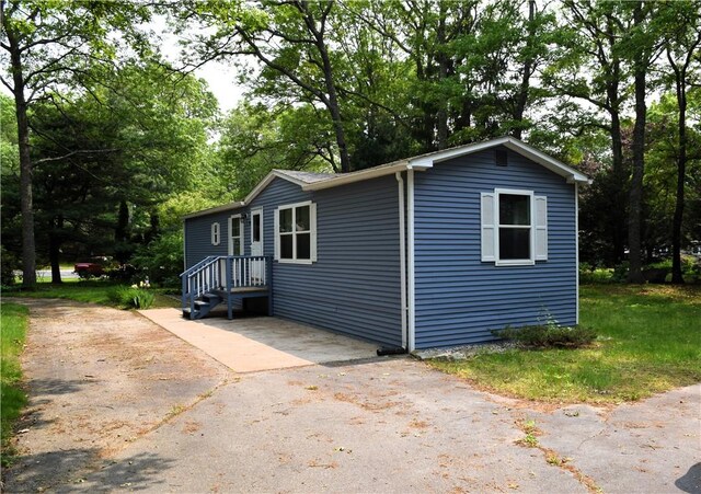 19 Jacob Perry Dr, Charlestown, RI 02831 - view of front of house featuring view of scattered trees