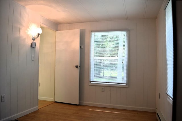 19 Jacob Perry Dr, Charlestown, RI 02831 - spare room with wood finished floors, healthy amount of natural light, and baseboards