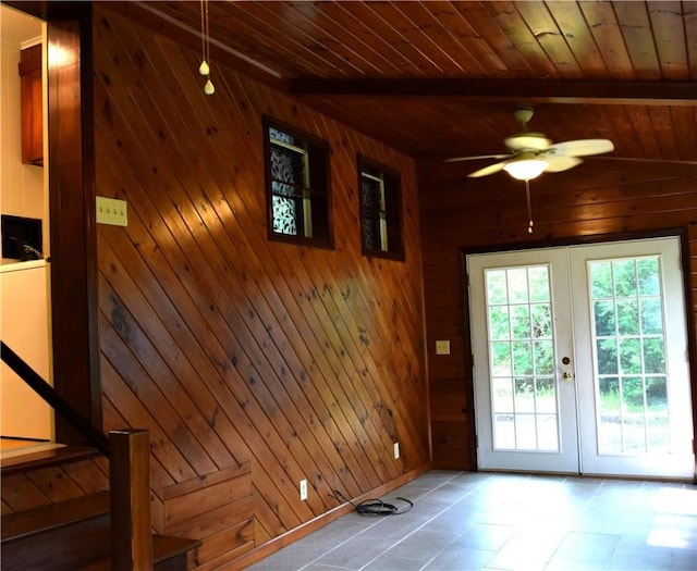 19 Jacob Perry Dr, Charlestown, RI 02831 - entryway featuring french doors, wood walls, a ceiling fan, wooden ceiling with exposed beams, and tile patterned flooring