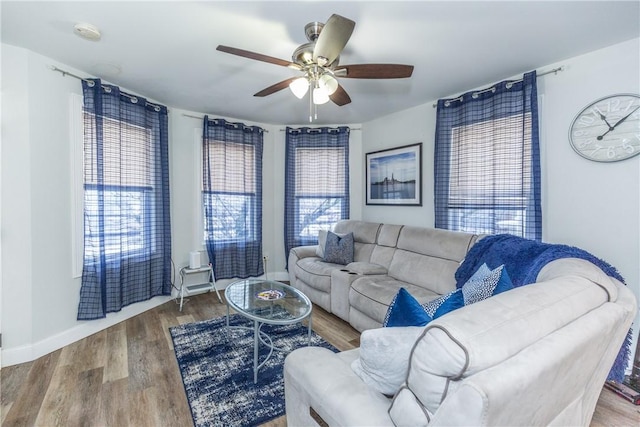 214 Silver Spring St, Providence, RI 02904 - living area with ceiling fan, plenty of natural light, wood finished floors, and baseboards