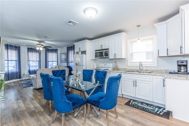 214 Silver Spring St, Providence, RI 02904 - dining space featuring a ceiling fan and light wood-style floors