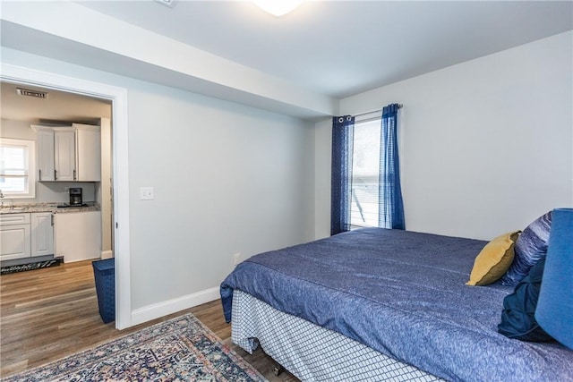 214 Silver Spring St, Providence, RI 02904 - bedroom with wood finished floors and baseboards