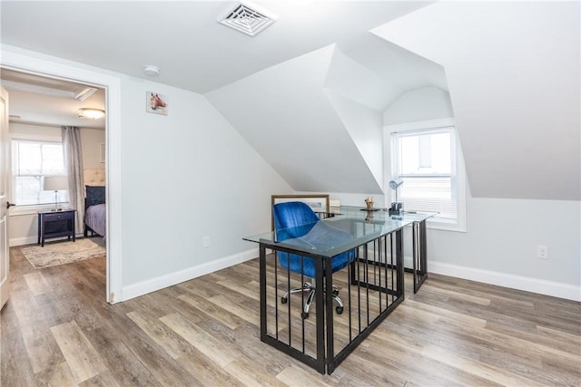 214 Silver Spring St, Providence, RI 02904 - additional living space featuring wood finished floors, a desk, plenty of natural light, lofted ceiling, and baseboards