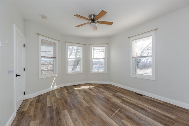 214 Silver Spring St, Providence, RI 02904 - empty room featuring wood finished floors, a ceiling fan, baseboards, and a smoke detector