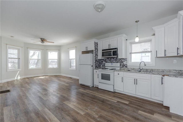 214 Silver Spring St, Providence, RI 02904 - kitchen featuring white appliances, a sink, a ceiling fan, dark wood-style floors, and healthy amount of natural light