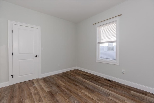 214 Silver Spring St, Providence, RI 02904 - empty room featuring wood finished floors and baseboards