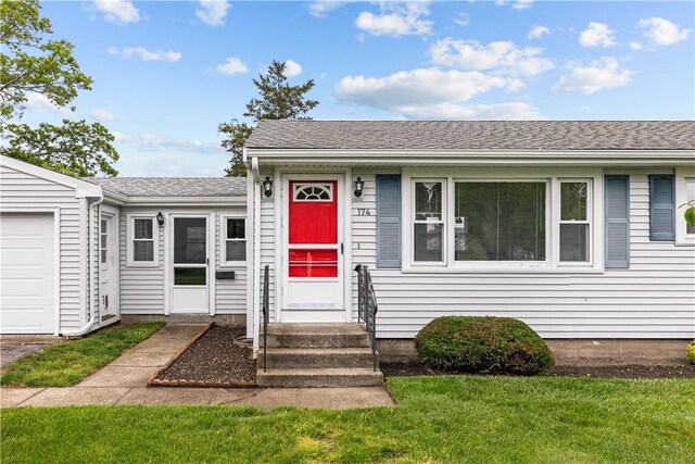 174 Russell Dr, Tiverton, RI 02878 - view of front of home with entry steps, a front lawn, an attached garage, and roof with shingles
