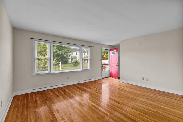174 Russell Dr, Tiverton, RI 02878 - empty room with wood finished floors and baseboard heating
