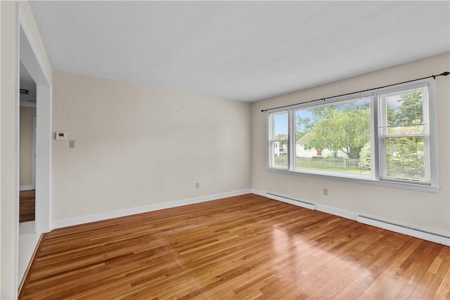 174 Russell Dr, Tiverton, RI 02878 - unfurnished room with baseboard heating and light wood-style flooring