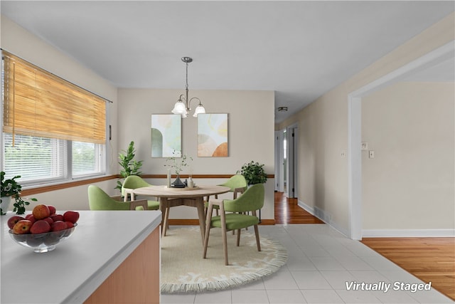 174 Russell Dr, Tiverton, RI 02878 - dining area featuring a chandelier and light tile patterned floors