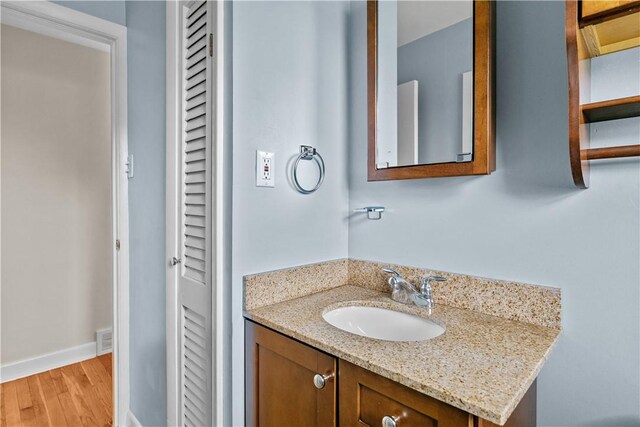 174 Russell Dr, Tiverton, RI 02878 - bathroom featuring vanity, a closet, and wood finished floors