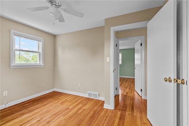 174 Russell Dr, Tiverton, RI 02878 - empty room featuring light wood-style flooring and a ceiling fan
