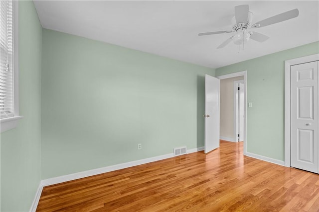 174 Russell Dr, Tiverton, RI 02878 - unfurnished bedroom featuring light wood-style floors and ceiling fan