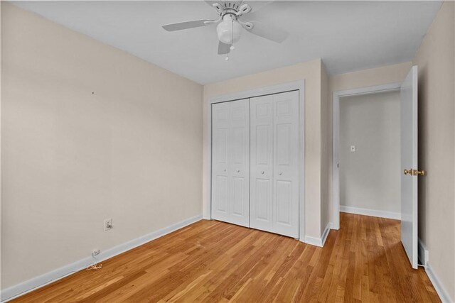 174 Russell Dr, Tiverton, RI 02878 - unfurnished bedroom with light wood-style floors, a closet, and a ceiling fan