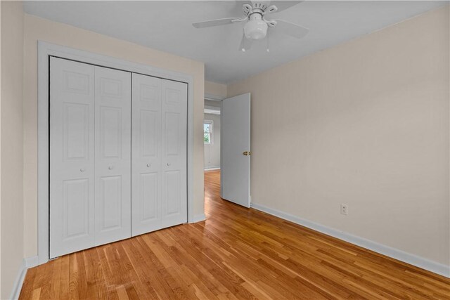 174 Russell Dr, Tiverton, RI 02878 - unfurnished bedroom featuring light wood finished floors, a closet, and ceiling fan