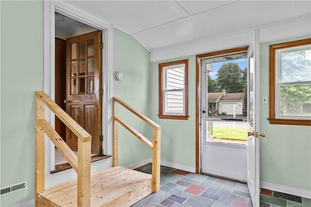 174 Russell Dr, Tiverton, RI 02878 - entryway featuring stone finish floors and vaulted ceiling