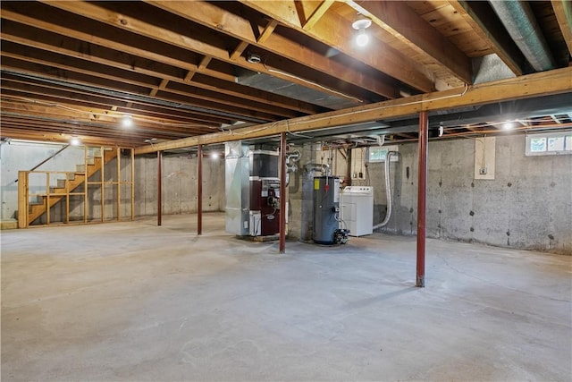 174 Russell Dr, Tiverton, RI 02878 - basement with water heater, heating unit, washer / dryer, and stairs