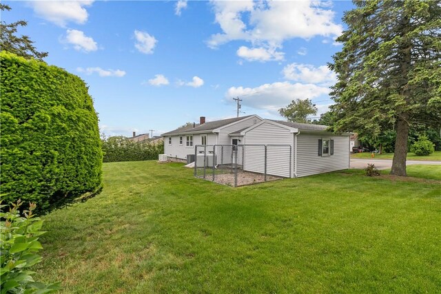 174 Russell Dr, Tiverton, RI 02878 - back of house with a yard and a chimney