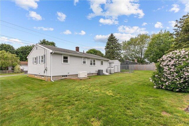 174 Russell Dr, Tiverton, RI 02878 - back of property with a chimney