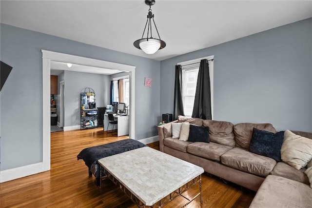 83 Pekin St, Providence, RI 02908 - living area featuring baseboards and wood finished floors