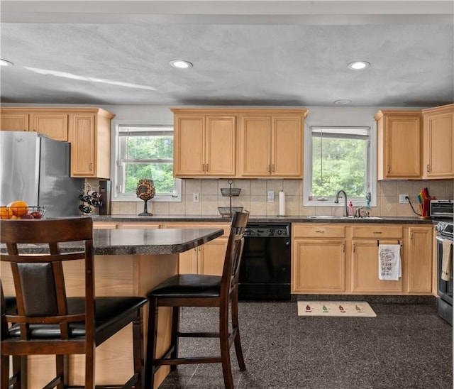 386 Mishnock Rd, West Greenwich, RI 02817 - kitchen with appliances with stainless steel finishes, healthy amount of natural light, a kitchen breakfast bar, a sink, and recessed lighting