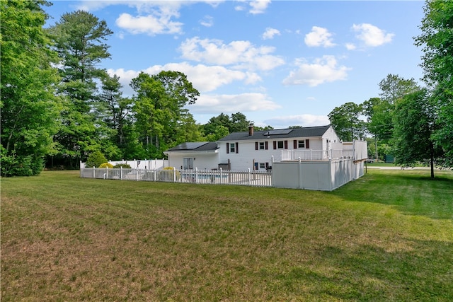 386 Mishnock Rd, West Greenwich, RI 02817 - rear view of house with solar panels, a swimming pool, and a patio area