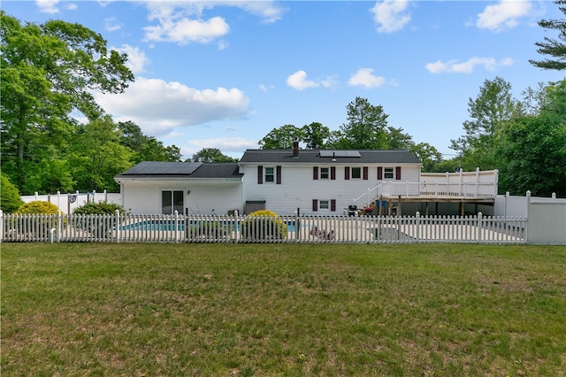 386 Mishnock Rd, West Greenwich, RI 02817 - rear view of house with a wooden deck, a patio area, roof mounted solar panels, and stairway