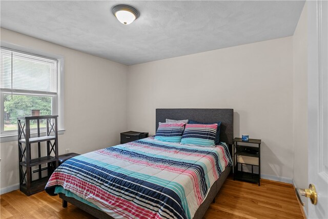 386 Mishnock Rd, West Greenwich, RI 02817 - bedroom with wood finished floors and baseboards