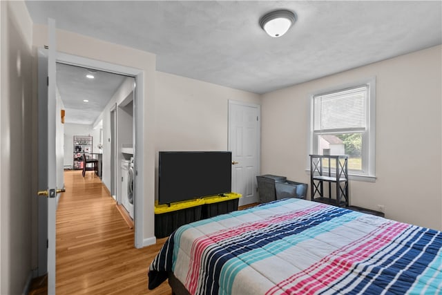 386 Mishnock Rd, West Greenwich, RI 02817 - bedroom with light wood-style flooring, recessed lighting, baseboards, and washer / dryer