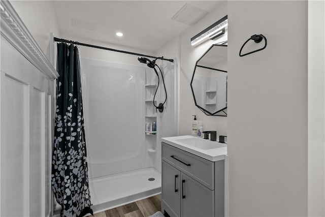 386 Mishnock Rd, West Greenwich, RI 02817 - bathroom with vanity, wood finished floors, a shower with shower curtain, and recessed lighting