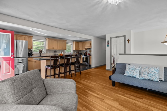 386 Mishnock Rd, West Greenwich, RI 02817 - living room with light wood-type flooring, recessed lighting, and baseboards