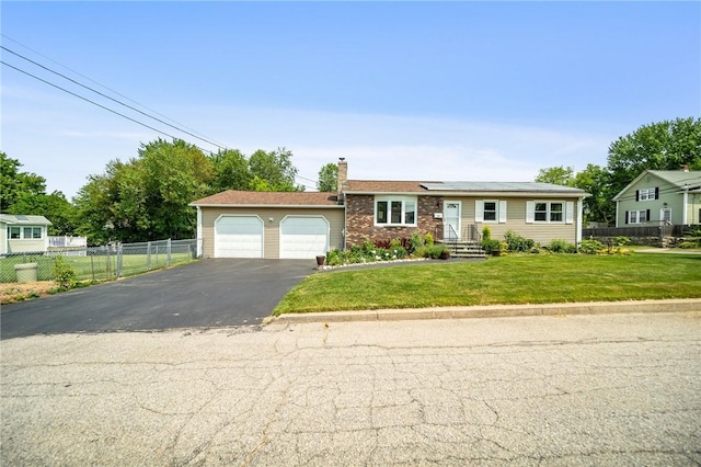 32 Myron St, West Warwick, RI 02893 - ranch-style home with a chimney, driveway, a garage, and roof mounted solar panels