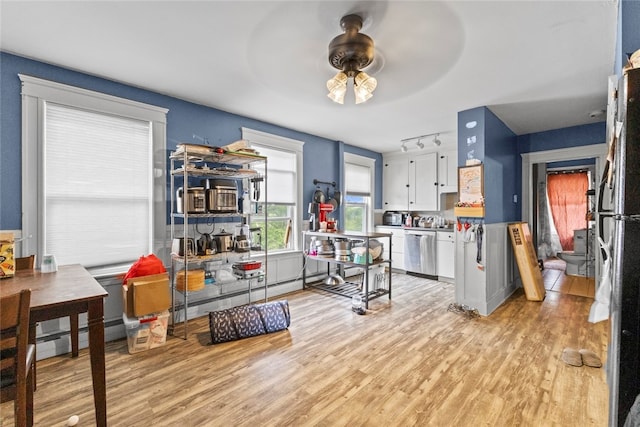 20 Cold Spring Pl, Woonsocket, RI 02895 - kitchen featuring a ceiling fan, light wood-style flooring, white cabinetry, stainless steel dishwasher, and track lighting
