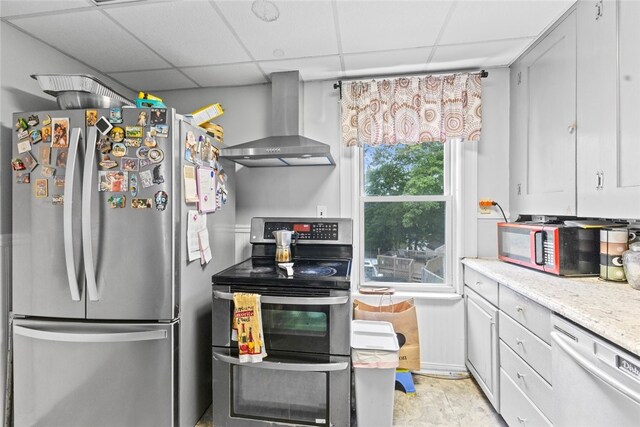20 Cold Spring Pl, Woonsocket, RI 02895 - kitchen with stainless steel appliances, wall chimney range hood, and a paneled ceiling