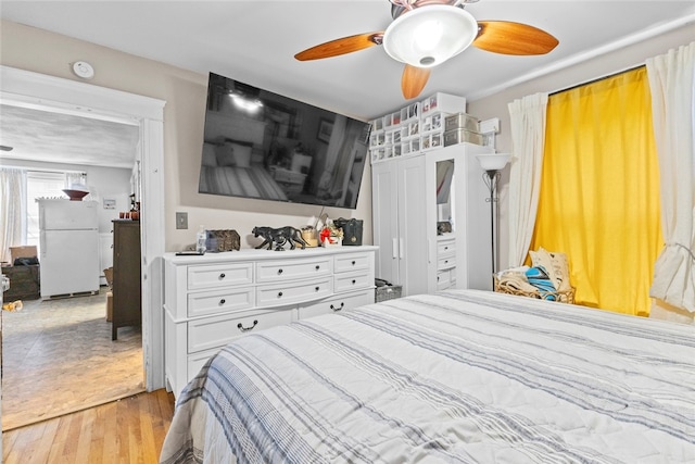 20 Cold Spring Pl, Woonsocket, RI 02895 - bedroom with freestanding refrigerator, wood-type flooring, and a ceiling fan
