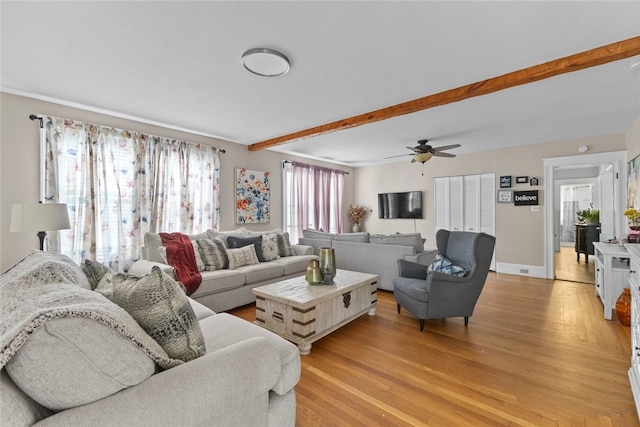 20 Cold Spring Pl, Woonsocket, RI 02895 - living room featuring light wood-type flooring, beamed ceiling, ceiling fan, and baseboards