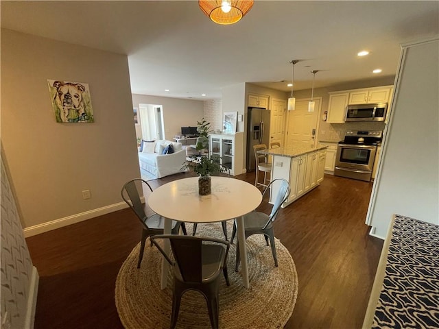 60 Saw Mill Dr Unit 303, North Kingstown, RI 02852 - dining area with baseboards, dark wood-style flooring, and recessed lighting